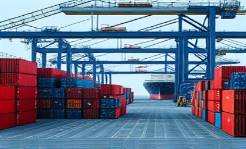 highdensity plastic, neatly stacked, ready for shipping, photorealistic, spacious shipping yard with cranes and containers, highly detailed, ships being loaded, 300 dpi, deep blue and grey tones, natural daylight, shot with a telephoto lens.