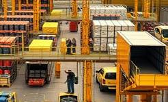 plastic shipping, distribution process, workers loading trucks, photorealistic, bustling distribution center with workers and vehicles, highly detailed, conveyer belts operating, ultra high-definition, warm yellow hues, soft ambient lighting, shot with a standard zoom lens.